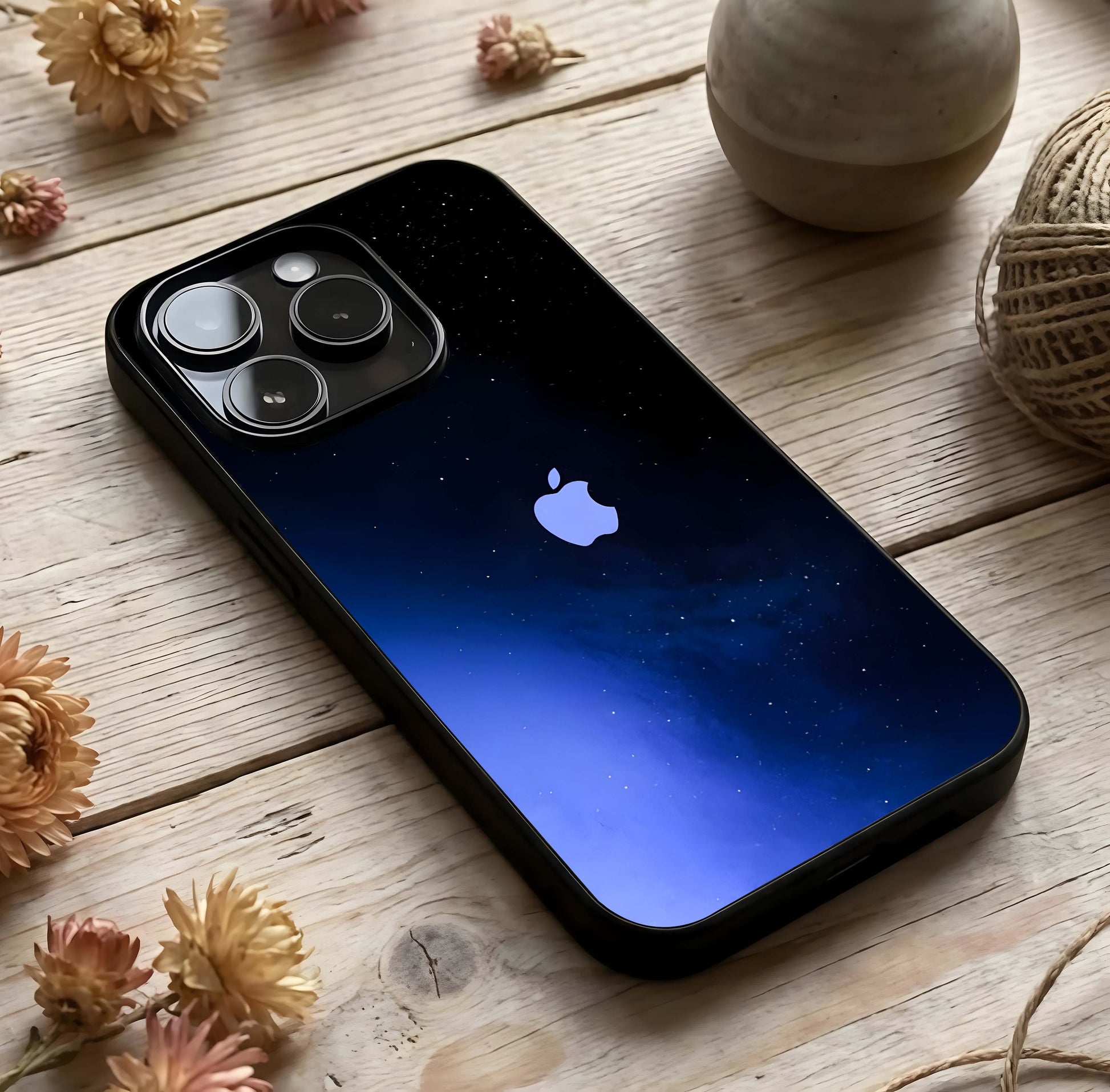 Cosmic Blue Apple Glass Case photographed in natural light showing reflective finish and cosmic depth.