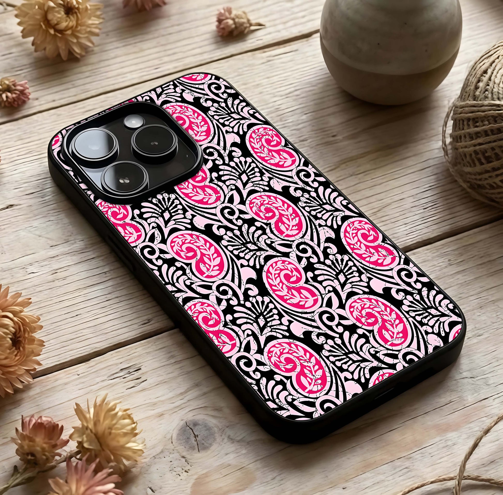Crimson Paisley Charm Glass Case photographed in natural light showing reflective finish and artistic depth.