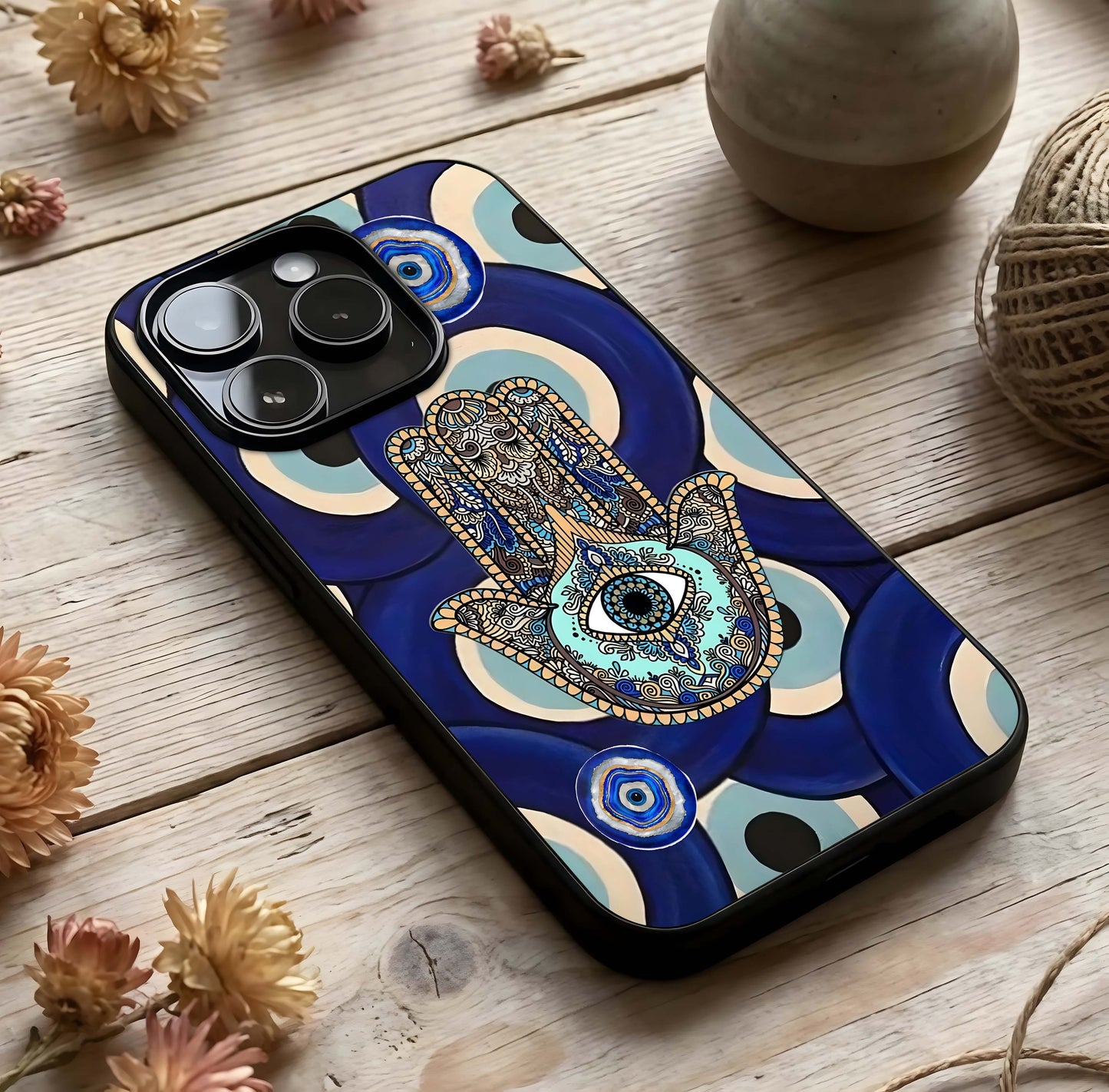 Hamsa Divine Guard Glass Case photographed in natural light showing reflective finish and divine depth.