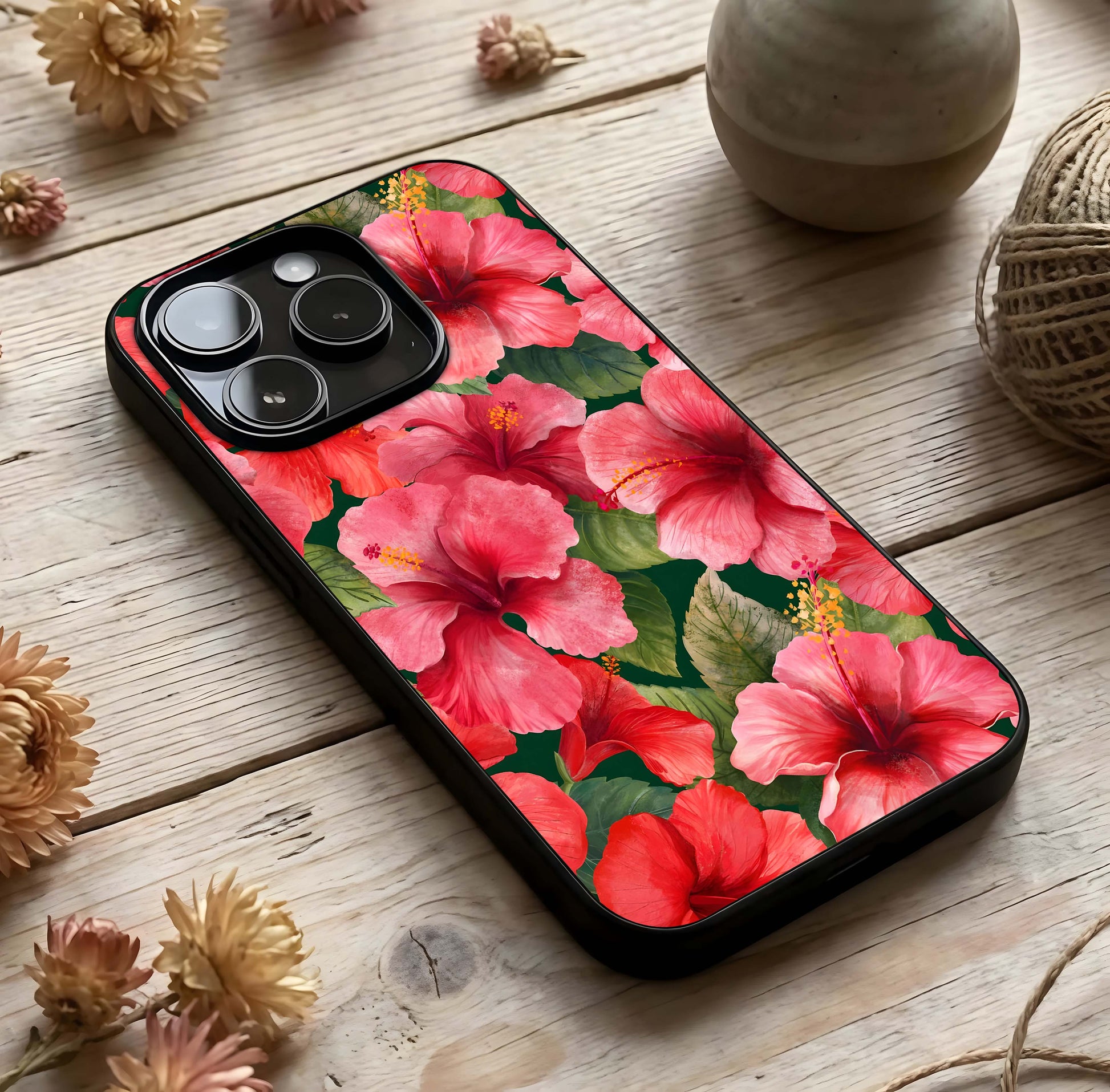 Hibiscus Pattern Glass Case photographed in natural light showing reflective finish and tropical depth.