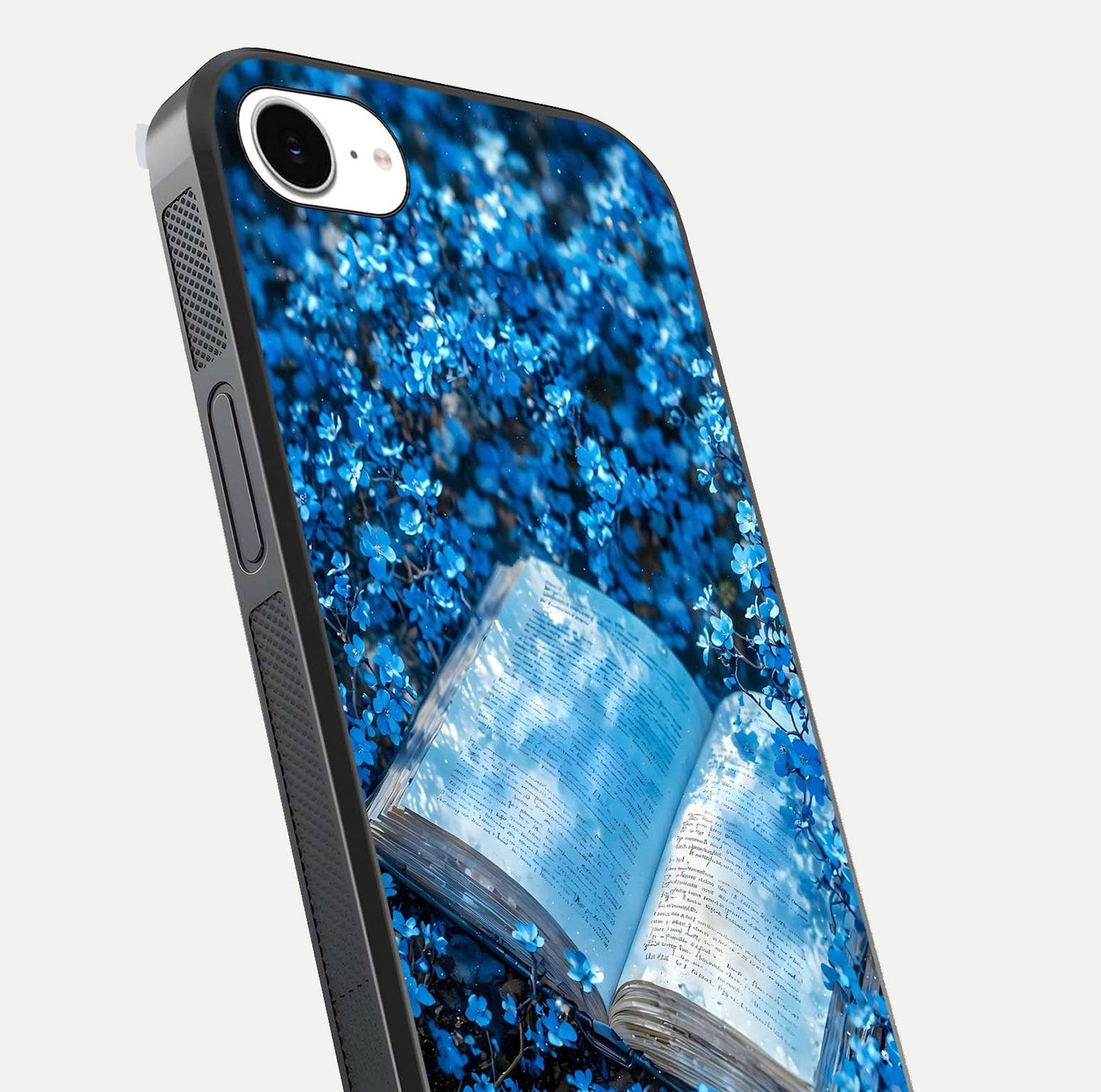 Blue Bloom Tales Glass Case for iPhone 16e close-up angle showing petal texture and blue tone reflection