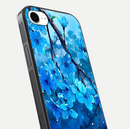 Blue Blossoms Branch Glass Case for iPhone 16e close-up angle highlighting petal details and reflection gloss