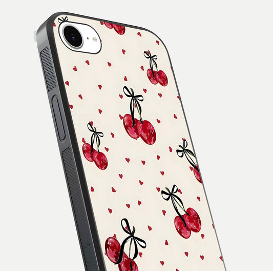 Cherry Heart Bow Glass Case for iPhone 16e close-up highlighting small bows, cherry red tones, and gloss shine