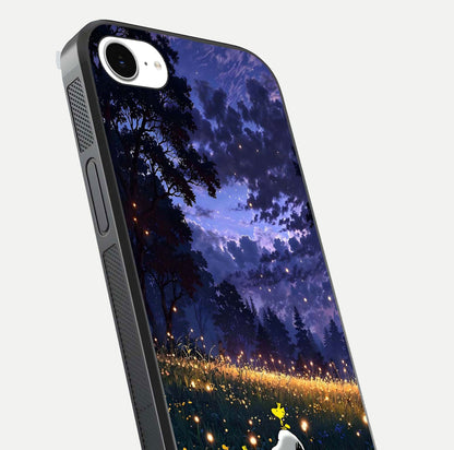 Firefly Meadow Magic Glass Case for iPhone 16e close-up highlighting luminous firefly light and reflection detail