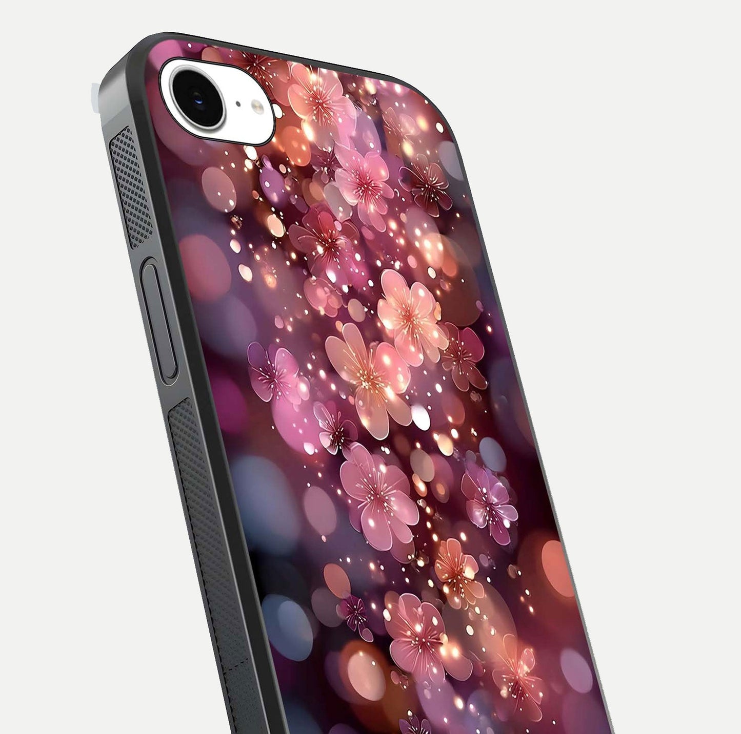 Glowing Petal Bliss Glass Case for iPhone 16e close-up angled shot showing petal glow, color depth, and reflection shine