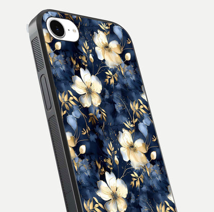 Golden Midnight Bloom Glass Case for iPhone 16e close-up angled shot showing floral detail and reflection shine