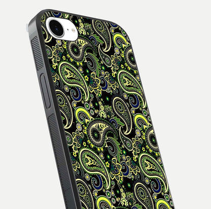 Green Mandala Pattern Glass Case for iPhone 16e close-up angled shot showing fine detailing and gold-green reflection