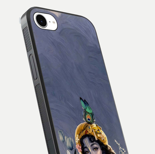 Lord Krishna Glass Case for iPhone 16e angled close-up showing intricate flute and reflection details