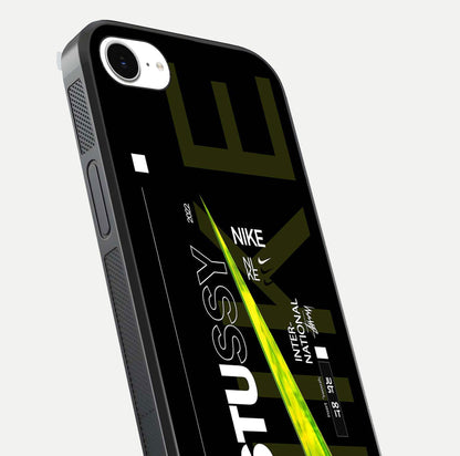 Neon Street Edition Glass Case for iPhone 16e close-up angled shot showing urban neon lights and shine