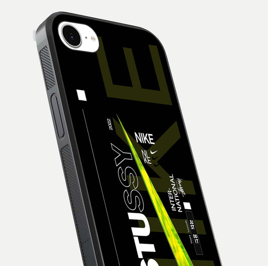 Neon Street Edition Glass Case for iPhone 16e close-up angled shot showing urban neon lights and shine