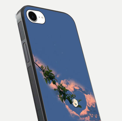 Sky Under Tree Glass Case for iPhone 16e close-up angled shot highlighting detail, color, and reflection