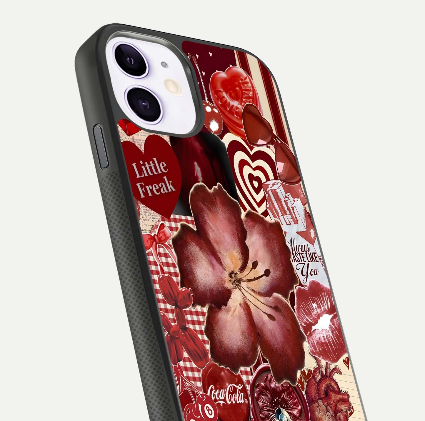 Aesthetic Little Freak Glass Case for iPhone 16 Pro close-up angled shot showing detailed artwork, bold design, and gloss reflection