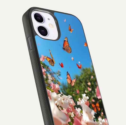 Butterflies in Bloom Sky Glass Case for iPhone 11 close-up shot showing wings, petal reflections, and soft hues