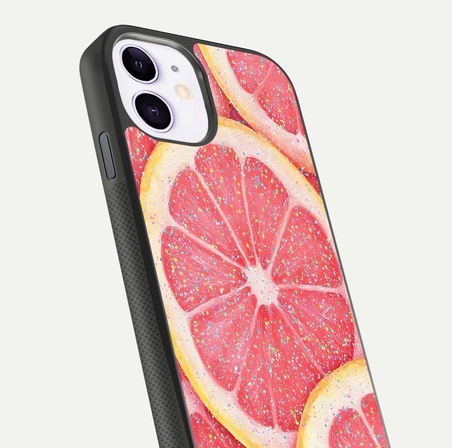 Glitter Grapefruit Glass Case for iPhone 11 close-up angled shot showing fruit texture and glitter reflection