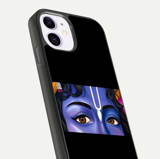 Krishna Eye Glass Case for iPhone 11 close-up angled shot showing intricate artwork and reflection shine