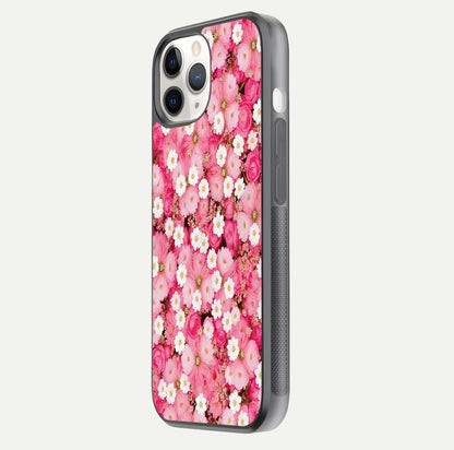 Pink Daisy Bliss Glass Case for iPhone 11 Pro side-angle image showing delicate daisy pattern and glass reflection