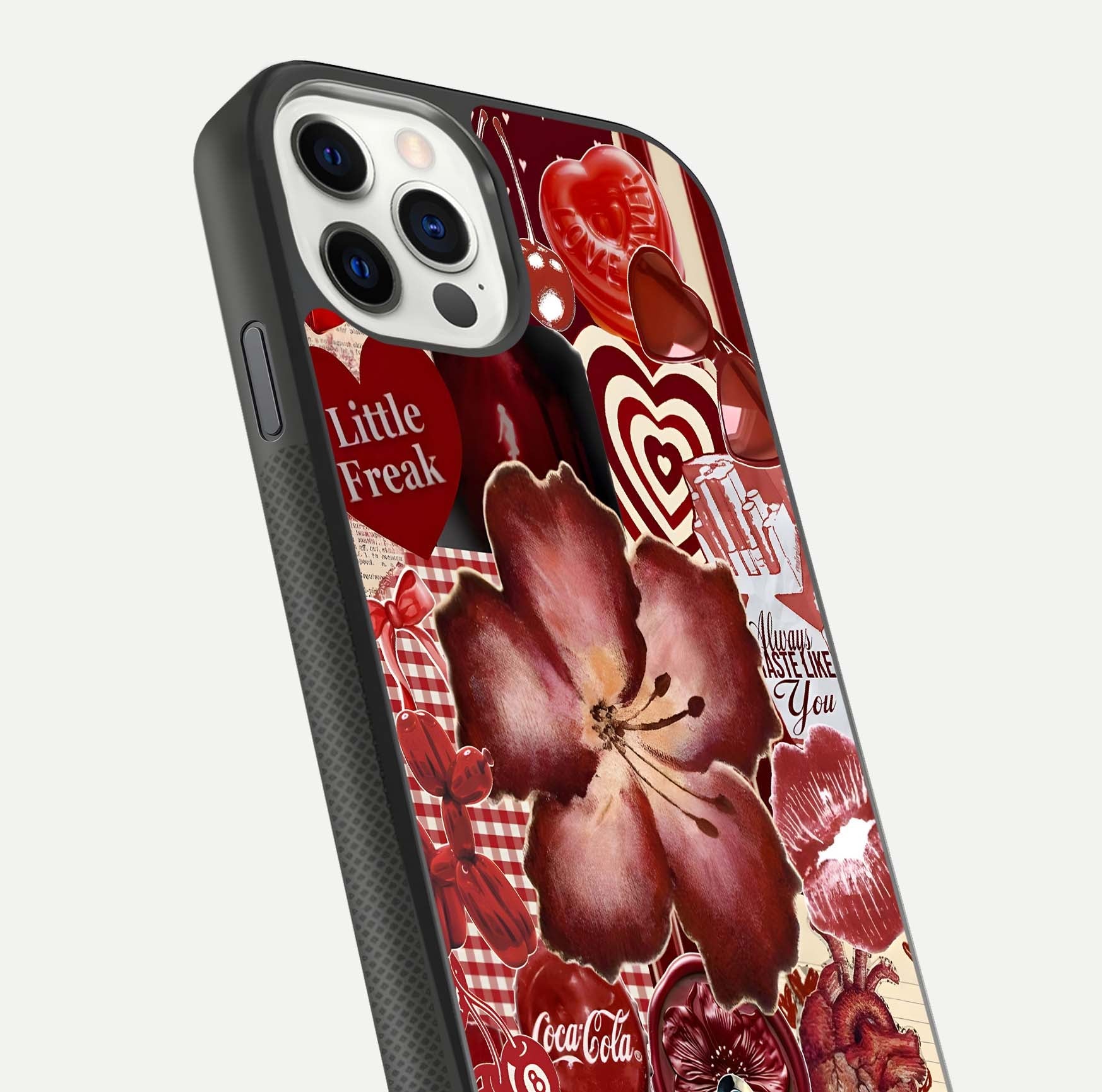Aesthetic Little Freak Glass Case for iPhone 16 Pro close-up angled shot showing detailed artwork, bold design, and gloss reflection