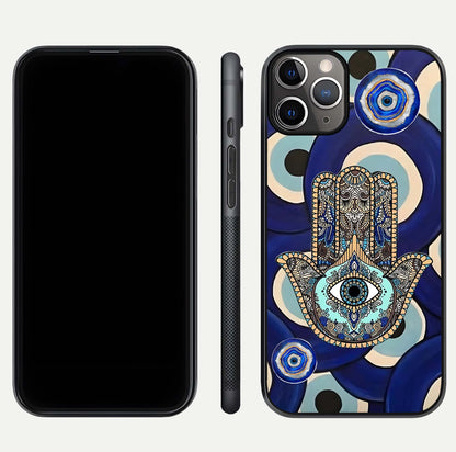 Hamsa Divine Guard Glass Case for iPhone 11 Pro Max close-up angled shot showing detailed palm motif and reflection glow