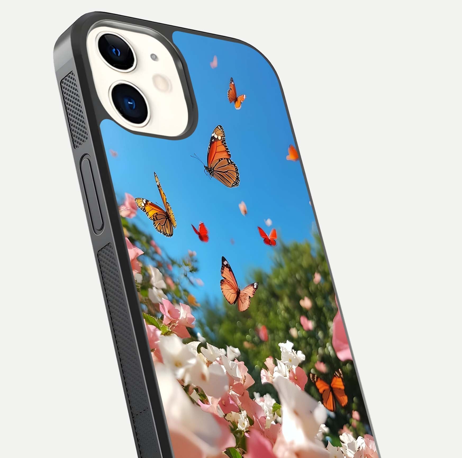 Butterflies in Bloom Sky Glass Case for iphone-12 close-up shot showing wings, petal reflections, and soft hues