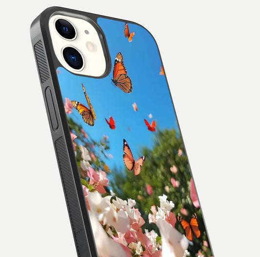 Butterflies in Bloom Sky Glass Case for iPhone 12 Mini close-up shot showing wings, petal reflections, and soft hues