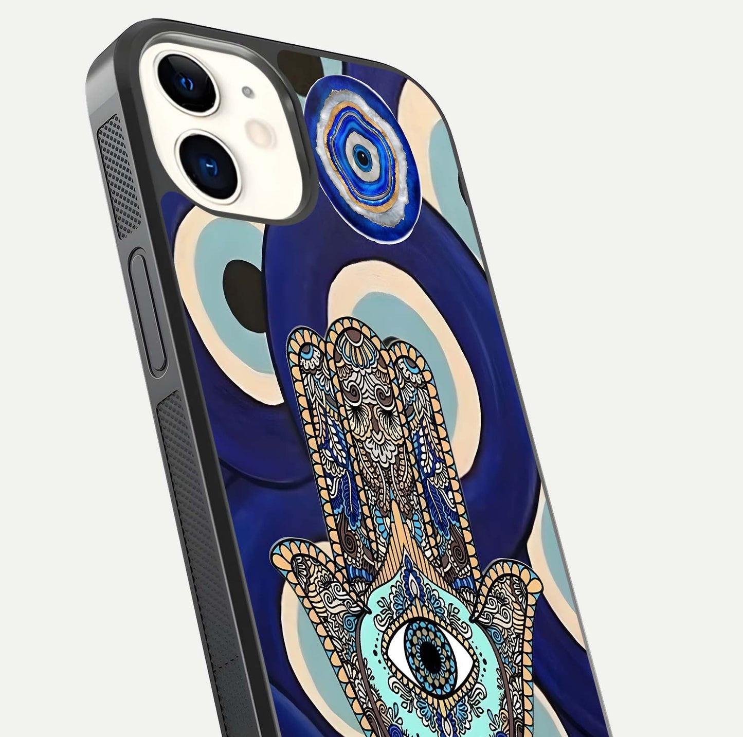 Hamsa Divine Guard Glass Case for iPhone 12 Mini close-up angled shot showing detailed palm motif and reflection glow