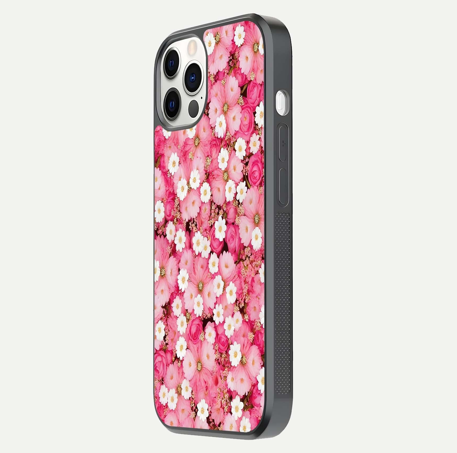 Pink Daisy Bliss Glass Case for iPhone 12 Pro side-angle image showing delicate daisy pattern and glass reflection