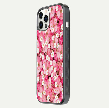 Pink Daisy Bliss Glass Case for iPhone 12 Pro side-angle image showing delicate daisy pattern and glass reflection