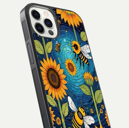 Bees & Sunflowers Glass Case for iPhone 12 Pro close-up angled shot showing detailed petals, bee prints, and glass reflection