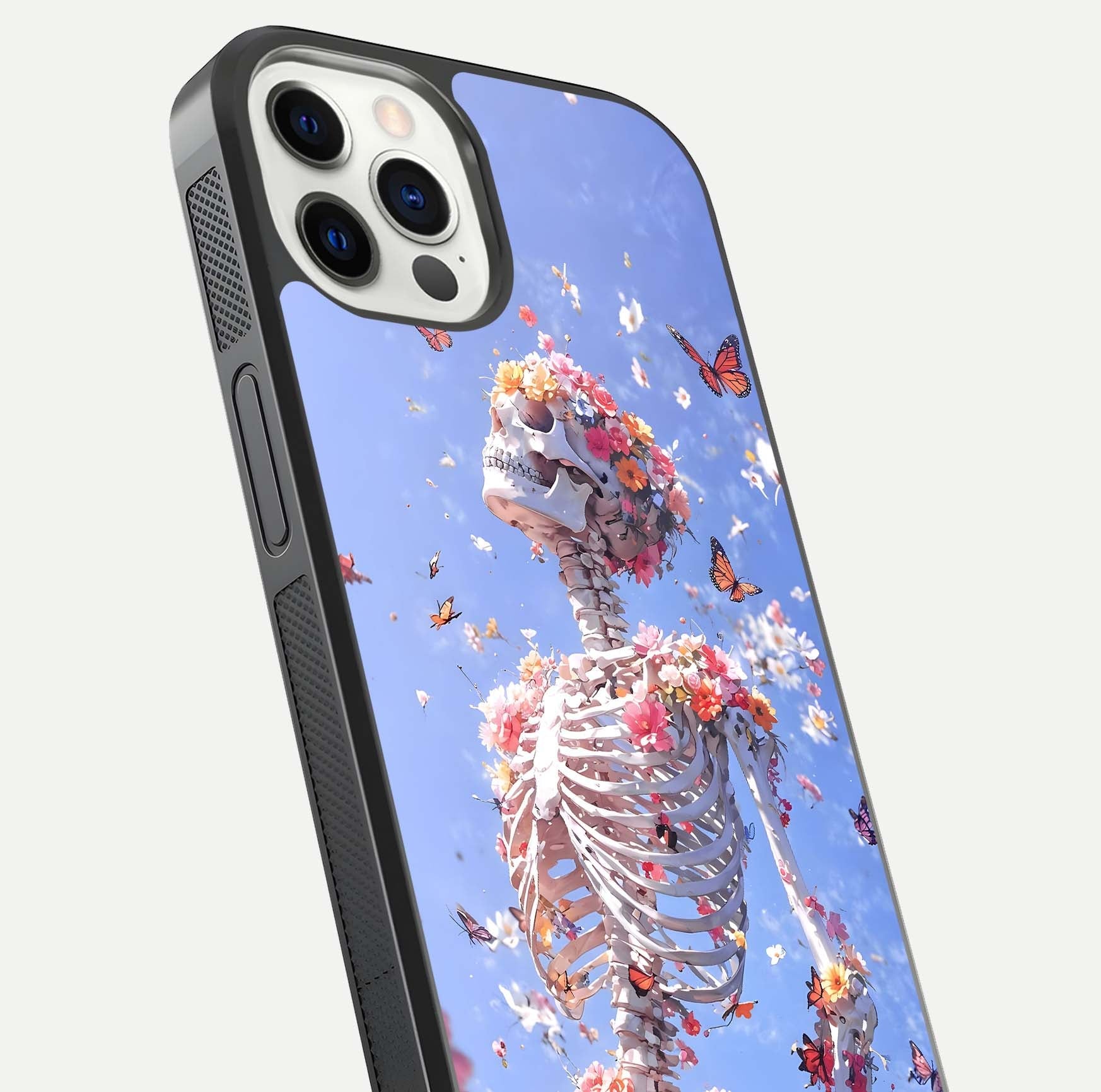 Bloom Beyond Bones Glass Case for iPhone 12 Pro close-up highlighting unique bone-floral fusion art and reflection
