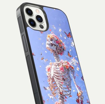 Bloom Beyond Bones Glass Case for iPhone 12 Pro close-up highlighting unique bone-floral fusion art and reflection