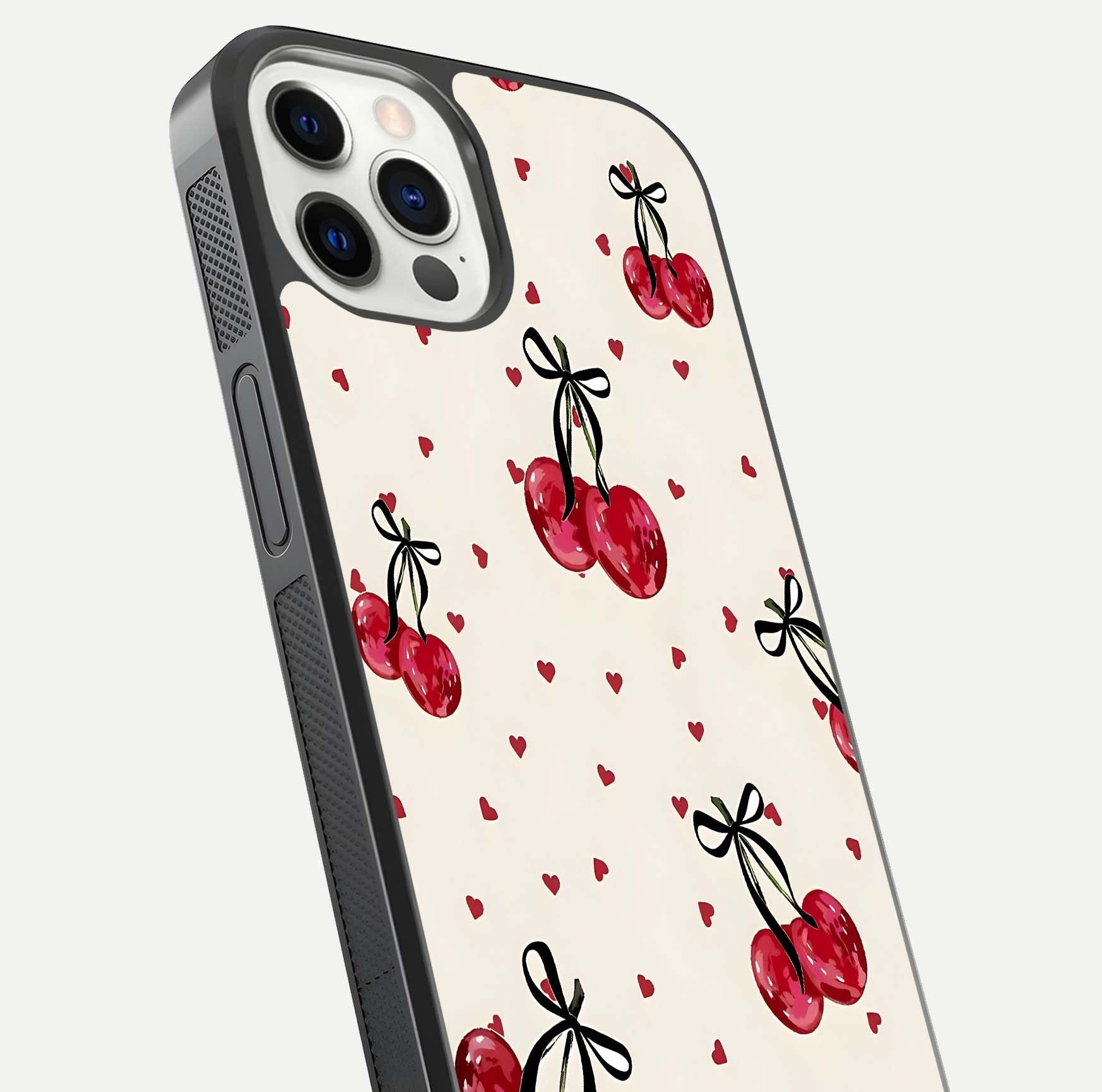 Cherry Heart Bow Glass Case for iPhone 12 Pro close-up highlighting small bows, cherry red tones, and gloss shine