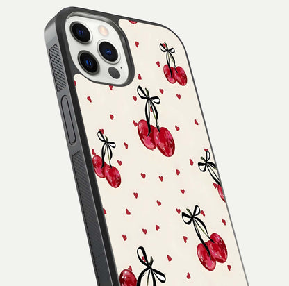 Cherry Heart Bow Glass Case for iPhone 12 Pro close-up highlighting small bows, cherry red tones, and gloss shine