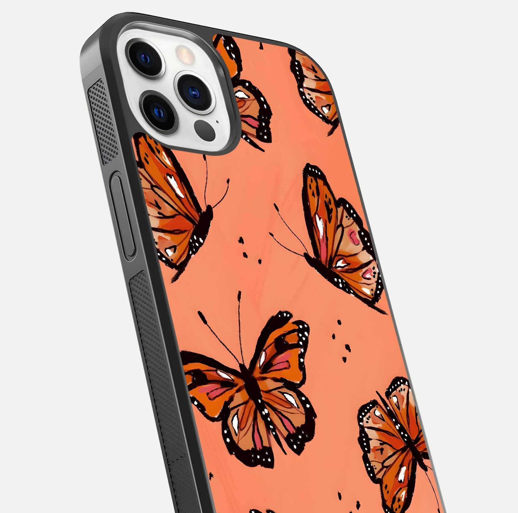 Coral Wing Butterfly Glass Case for iPhone 12 Pro close-up highlighting wing pattern, coral tones, and reflection shine