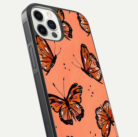 Coral Wing Butterfly Glass Case for iPhone 12 Pro close-up highlighting wing pattern, coral tones, and reflection shine