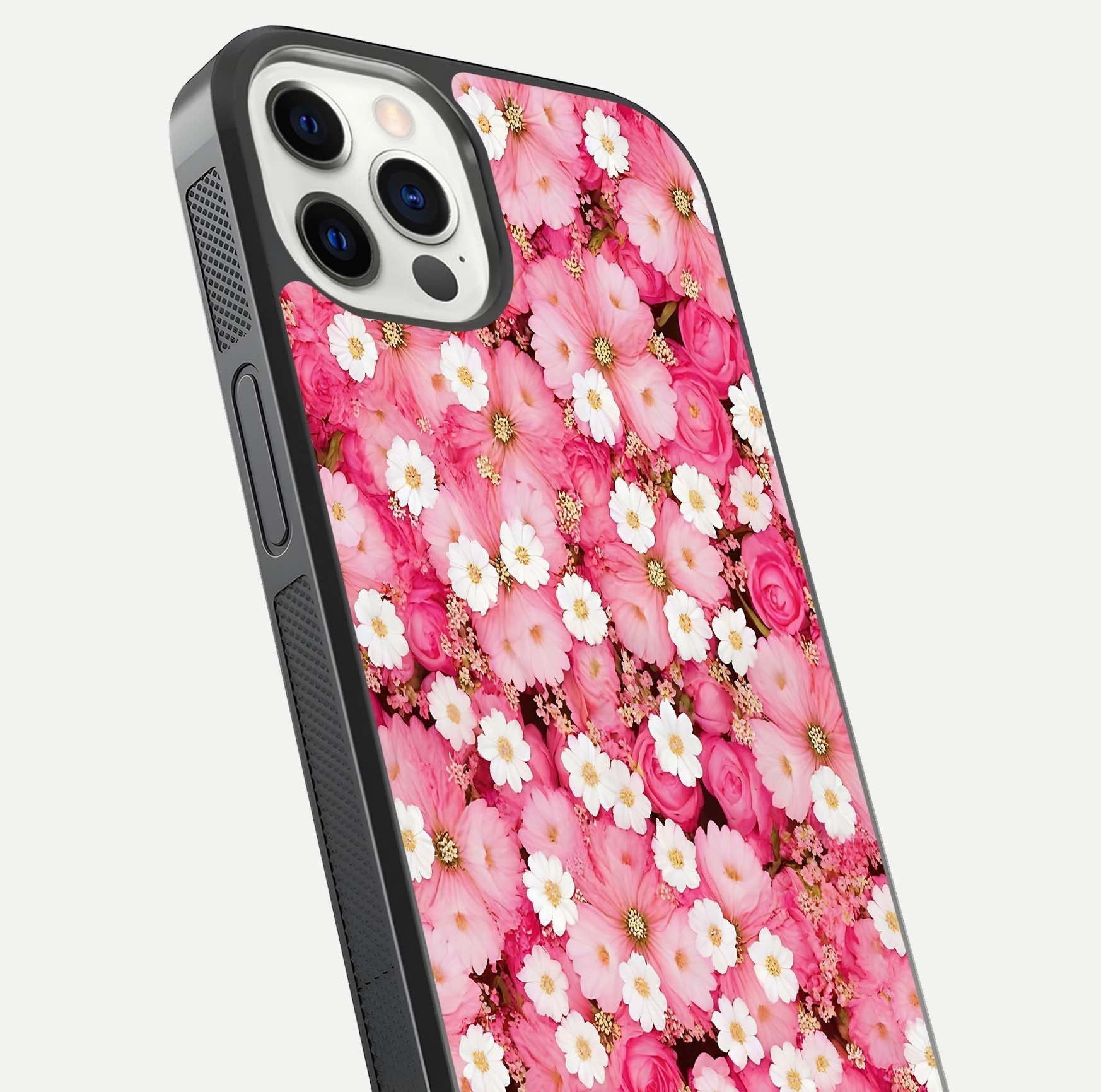 Pink Daisy Bliss Glass Case for iPhone 12 Pro close-up angled shot highlighting daisy detail and reflection glow
