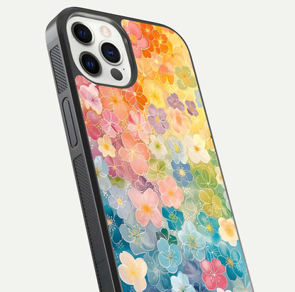 Rainbow Blossom Burst Glass Case for iPhone 12 Pro close-up angled shot showing petal colors and reflection