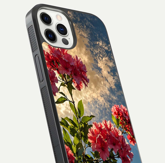 Red Bloom Skies Glass Case for iPhone 12 Pro close-up angled shot highlighting detailed blooms and reflection