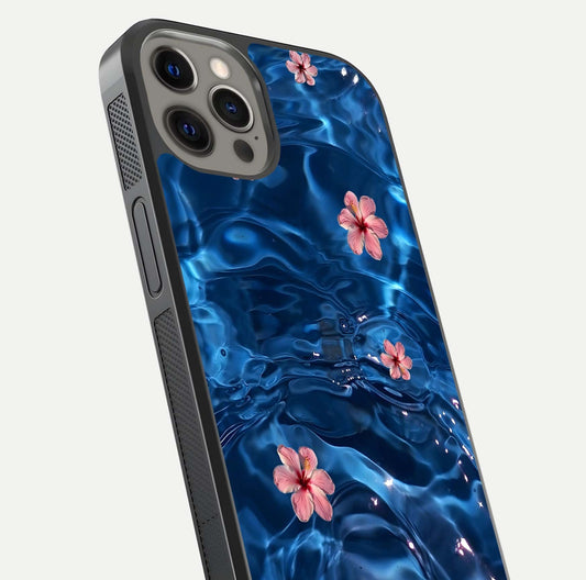 Blooming Water Drift Glass Case for iPhone 12 Pro Max close-up angle showing petal details, soft aqua tones, and smooth gloss reflection