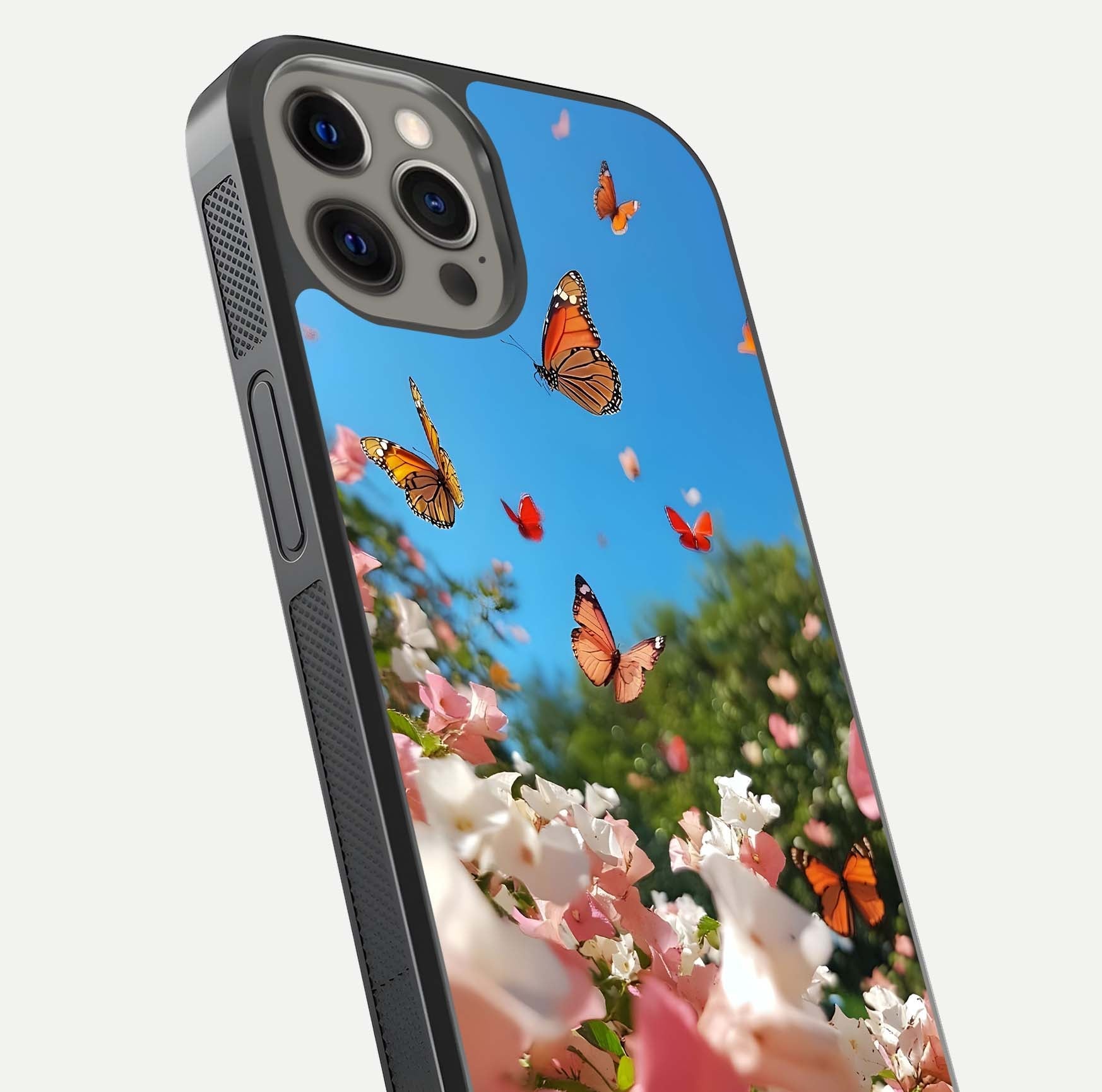 Butterflies in Bloom Sky Glass Case for iPhone 12 Pro Max close-up shot showing wings, petal reflections, and soft hues