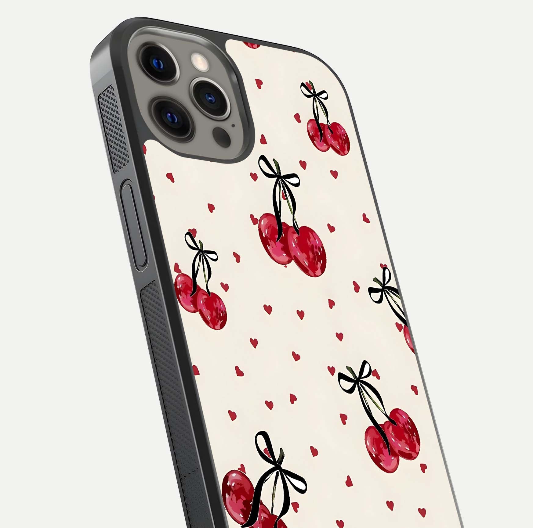 Cherry Heart Bow Glass Case for iPhone 12 Pro Max close-up highlighting small bows, cherry red tones, and gloss shine