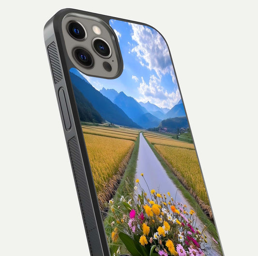Golden Field Journey Glass Case for iPhone 12 Pro Max close-up angled shot showing sunlight tones and reflection clarity