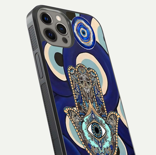 Hamsa Divine Guard Glass Case for iPhone 12 Pro Max close-up angled shot showing detailed palm motif and reflection glow