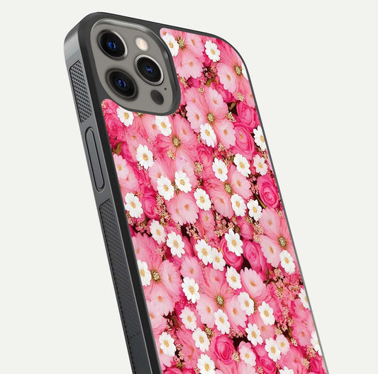 Pink Daisy Bliss Glass Case for iPhone 12 Pro Max close-up angled shot highlighting daisy detail and reflection glow