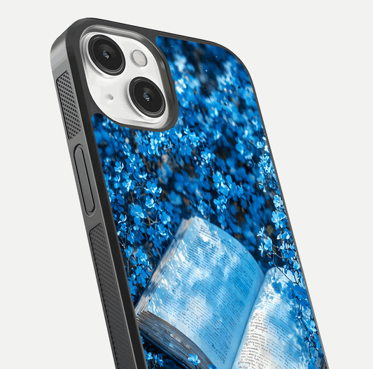 Blue Bloom Tales Glass Case for iPhone 13 close-up angle showing petal texture and blue tone reflection