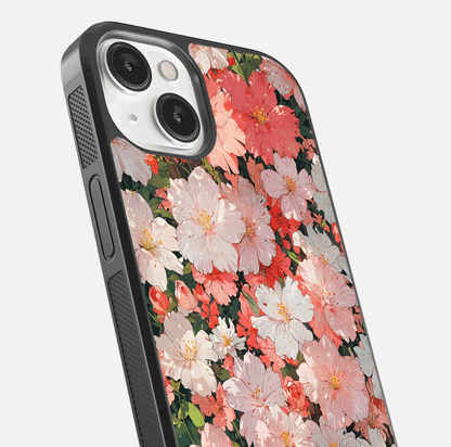 Blush Bloom Field Glass Case for iPhone 13 close-up shot capturing pastel flower field tones and gloss shine