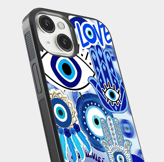 Evil Eyes Dream Glass Case for iPhone 13 close-up highlighting evil-eye charm detail and light reflection on glass
