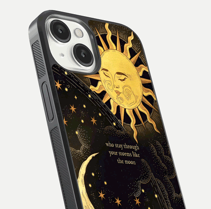 Golden Lunar Love Glass Case for iPhone 13 close-up angled shot showing moon glow, texture, and reflection polish