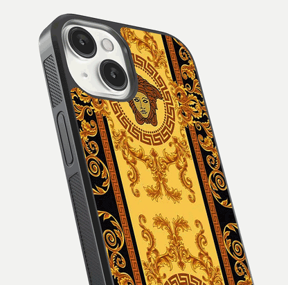 Golden Royal Heritage Glass Case for iPhone 13 close-up angled shot showing intricate design and metallic reflection