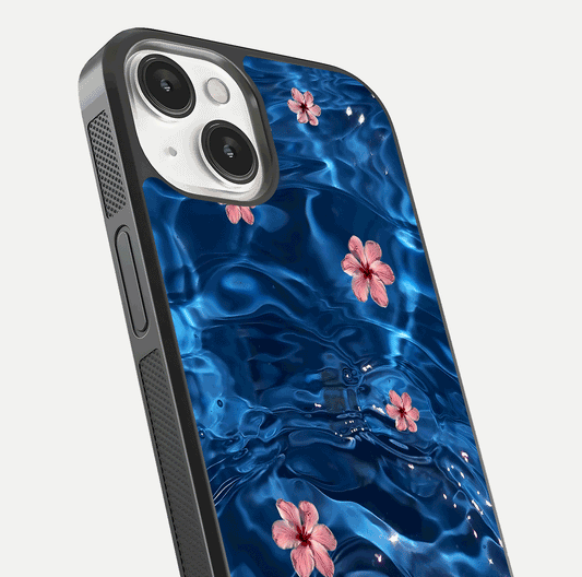 Blooming Water Drift Glass Case for iPhone 13 Mini close-up angle showing petal details, soft aqua tones, and smooth gloss reflection