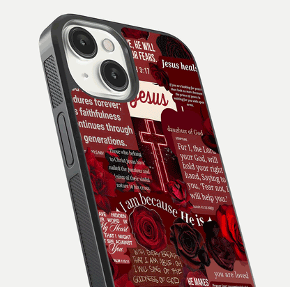 Jesus Love Heals Glass Case for iPhone 13 Mini close-up angled shot showing healing text, cross detailing, and reflection